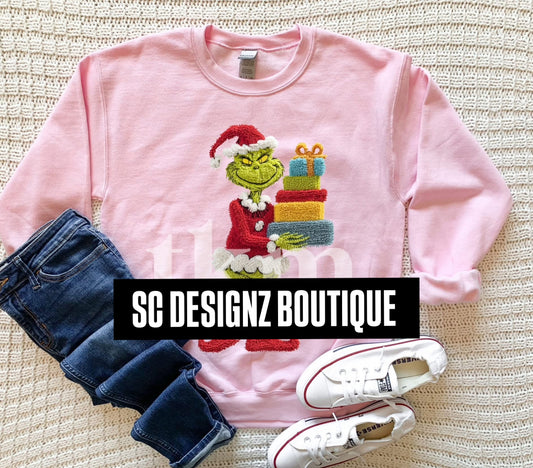 Plush Green man carrying presents