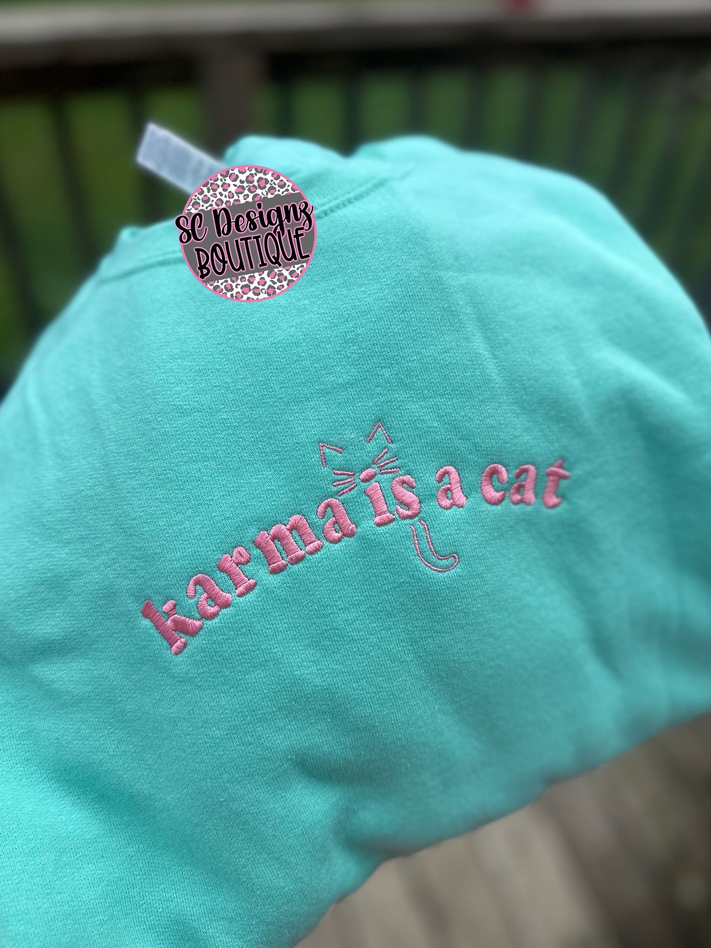 Karma is a cat embroidered sweatshirt