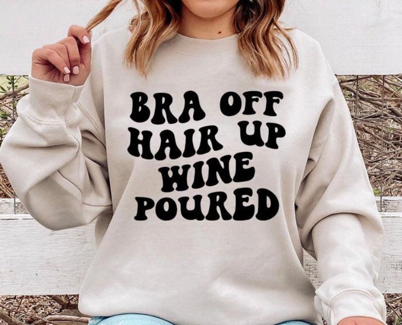 Bra off, hair up, wine poured sweatshirt